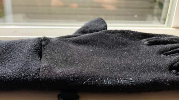 dakine storm liner gloves with logo showing