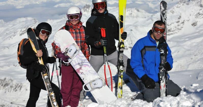 people with skis and snowboards people with skis and snowboards