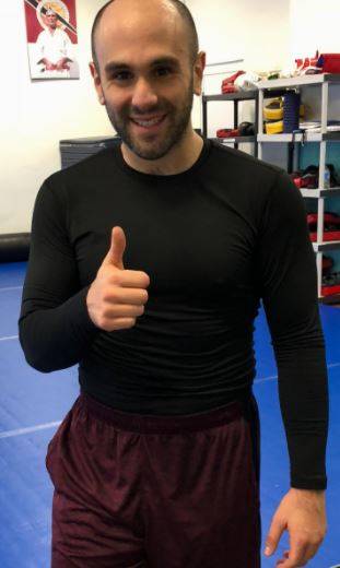 me wearing tesla wintergear during kickboxing