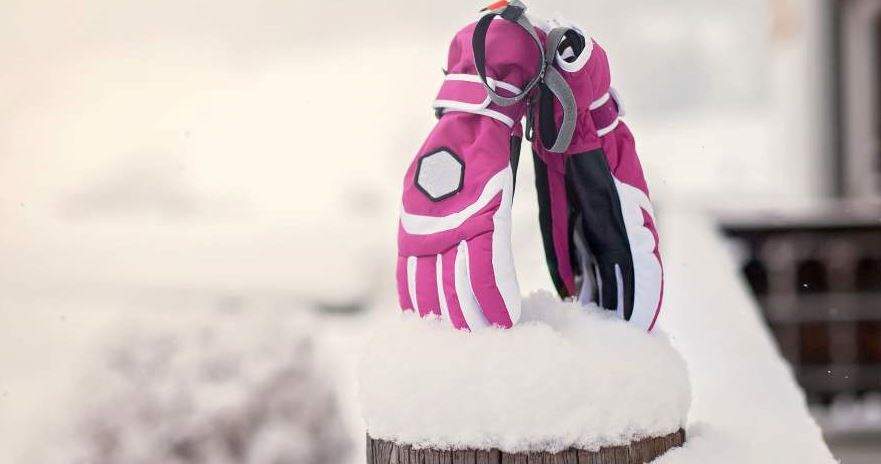 two gloves stuck in the snow